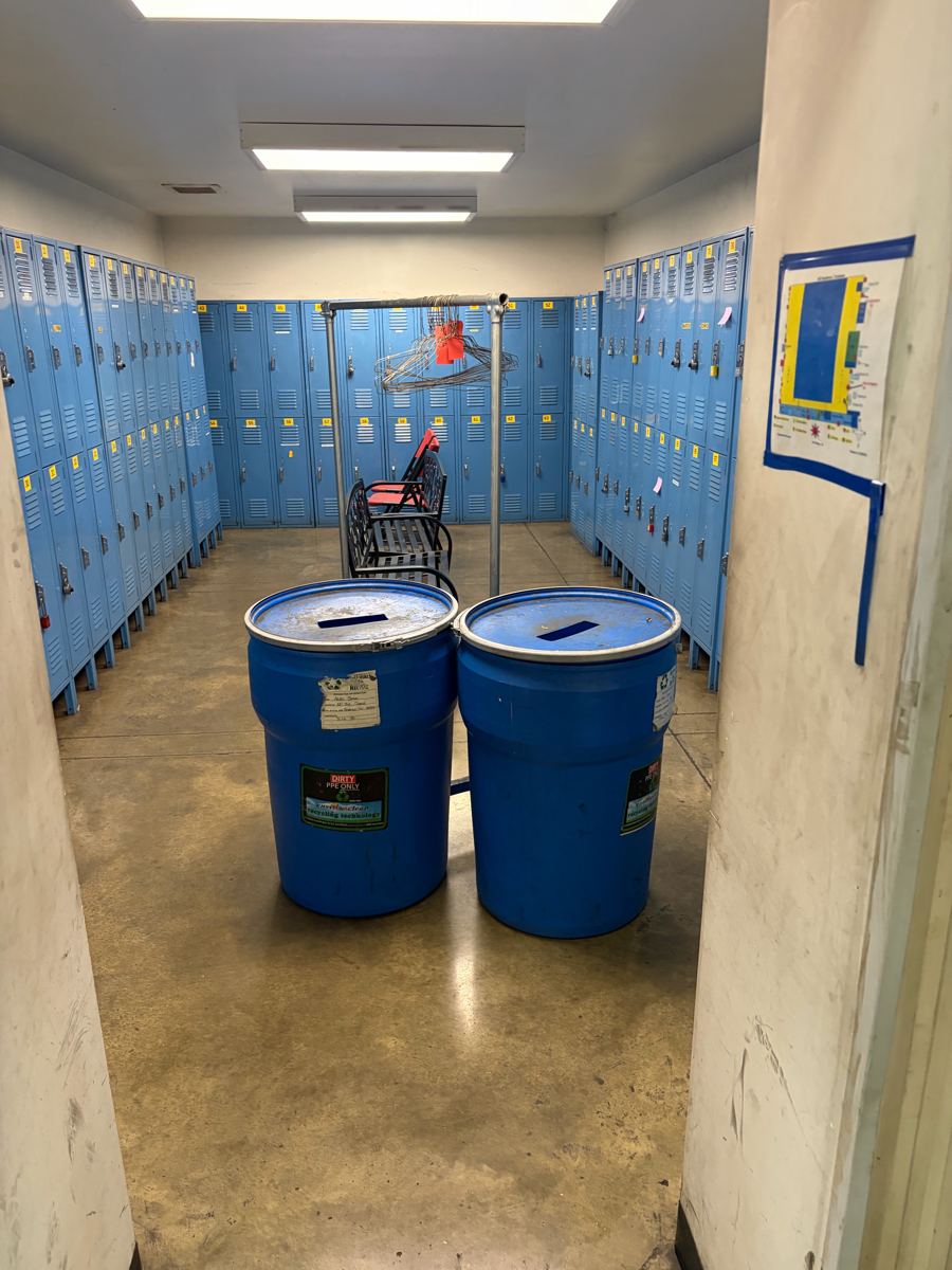 Clean employee locker room with emptied trash bins at a West Tennessee manufacturing plant